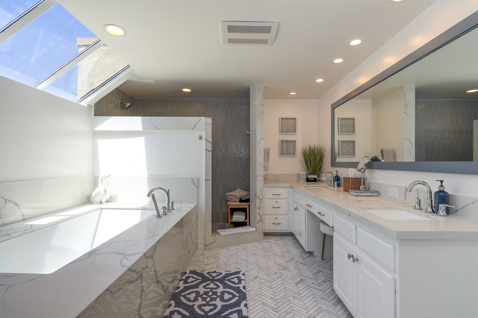 Bathroom with a soaking tub and skylight