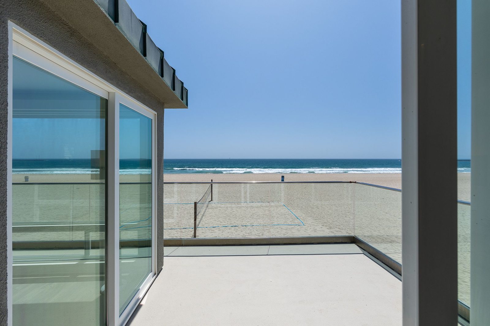 Ocean-view deck opening onto the sand at California Dreamin'