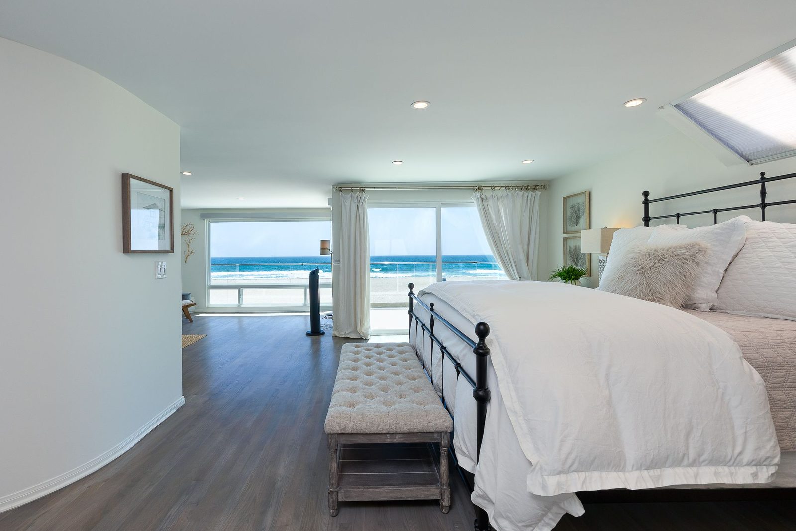 Primary suite with king bed and ocean view